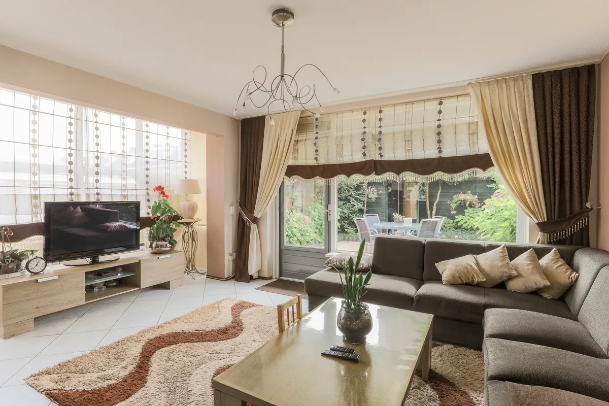 A sculptural neutral rug anchoring a contemporary living room