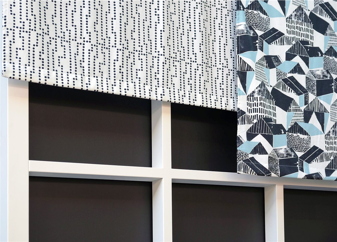 Geometric patterned tailored fabric valance above a window